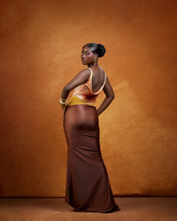 Full-length Ifeoma Dress in terracotta, amber and deep chocolate