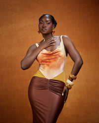 Draped ruching on the sunset-print Ifeoma maxi dress by NALÈ